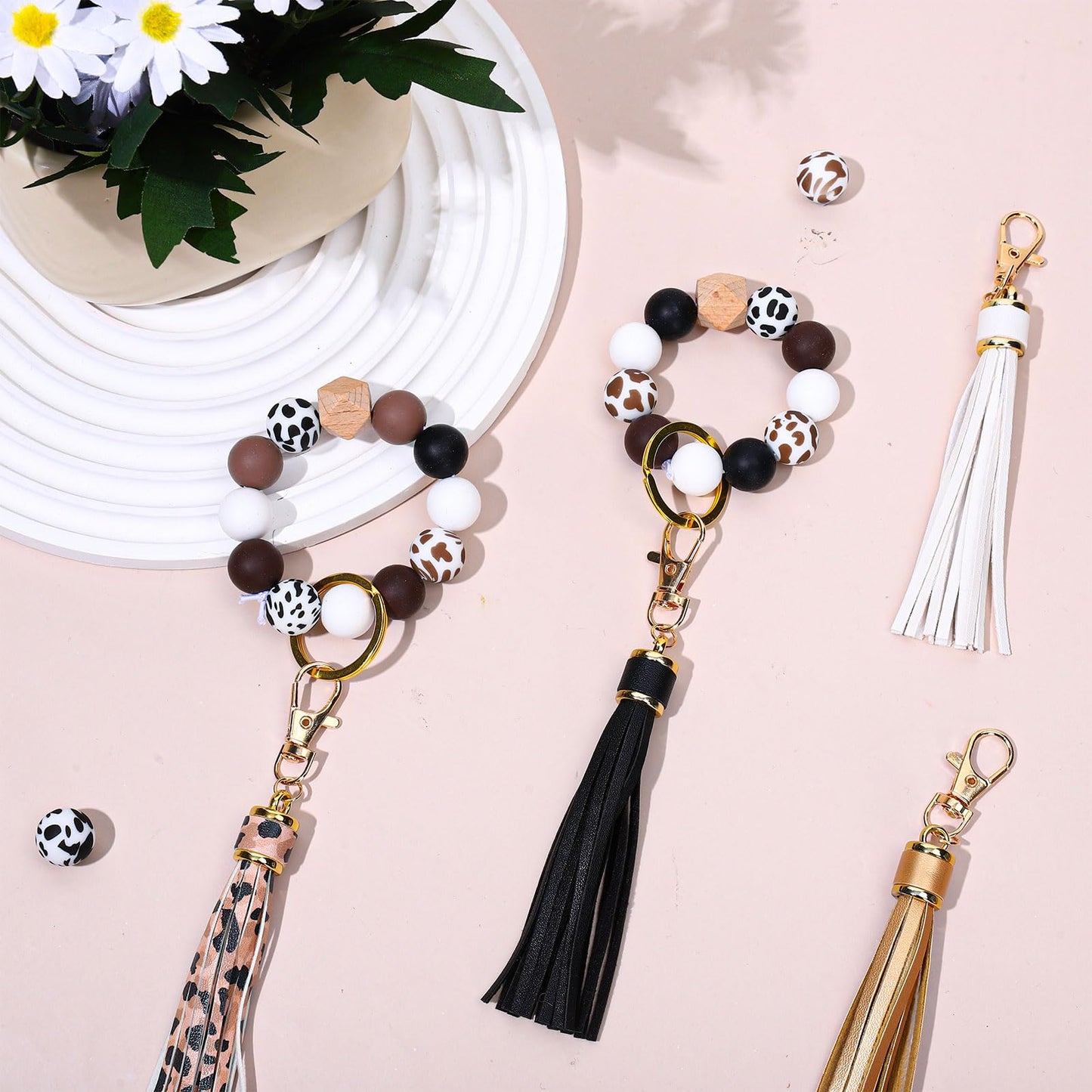 JarThenaAMCS 100Pcs Cow Print Silicone Beads Assorted Brown Black White Round Spacer Beads Keychain Making Kit with Elastic Rope Wood Key Rings and Tassels for DIY Crafts Jewelry Bracelet Pen